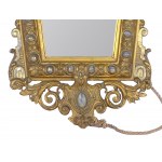 Mirror with finely carved frame and winged angel's head