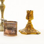 Lot of four silver-plated metal candlesticks in different shapes and sizes