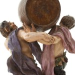 Satyrs with barrel and leopard, polychrome porcelain group,