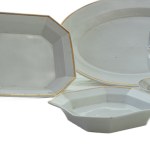 Lot of nine serving pieces in white porcelain with pure gold finish