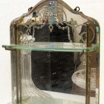 Lot of four objects: two bottles, one centerpiece and one mirror with shelves