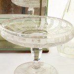 Lot of four objects: two bottles, one centerpiece and one mirror with shelves