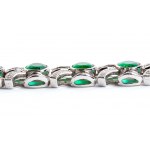 Bracelet en or avec lignes d'émeraudes et rubans de diamants