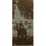 Organization Young Polish women , representatives in uniforms of the organization, in the last row visible banner , postcard photograph