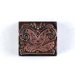 Decorative motif designed by Henryk Uziembło. Film form. 1.8x2.2 cm on a metal base.
