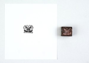 Decorative motif designed by Henryk Uziembło. Film form. 1.8x2.2 cm on a metal base.