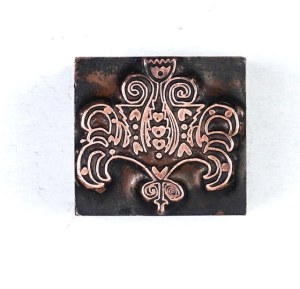 Decorative motif. Film form. 2.3x2.3 cm on a metal base.