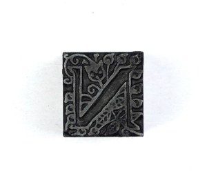Letter N. Film form. 1.7x1.7 cm on a metal base.