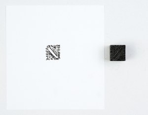 Letter N. Film form. 1.7x1.7 cm on a metal base.
