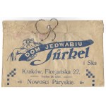 TÜRKEL i Ska. Dom Jedwabiu. Nowości Paryskie. [Torebka papierowa].