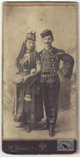B. Henner (younger) - a couple in stylized eastern costumes in a photograph from pocz....