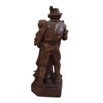 Wooden figure of a Tyrolean couple with a console