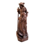 Wooden figure of a Tyrolean couple with a console