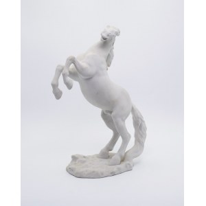 Horse standing on oak