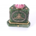 A magnificent clock in the shape of an egg, in the style of Carl Fabergé