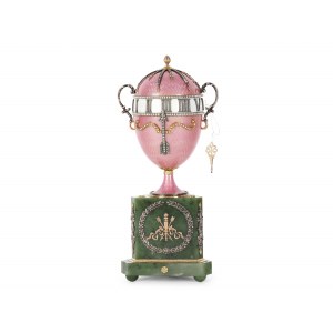 A magnificent clock in the shape of an egg, in the style of Carl Fabergé