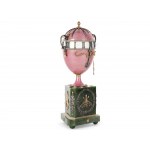 A magnificent clock in the shape of an egg, in the style of Carl Fabergé