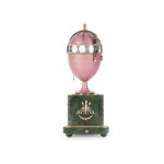 A magnificent clock in the shape of an egg, in the style of Carl Fabergé