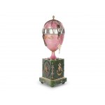 A magnificent clock in the shape of an egg, in the style of Carl Fabergé