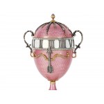 A magnificent clock in the shape of an egg, in the style of Carl Fabergé
