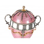 A magnificent clock in the shape of an egg, in the style of Carl Fabergé