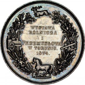 Medal autorstwa Below’a z 1874 roku wybity z okazji Wystawy Rolniczej i Przemysłowej w Toruniu.