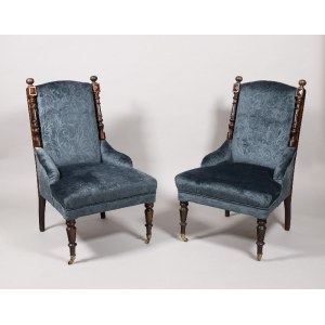 A pair of low armchairs in eclectic style