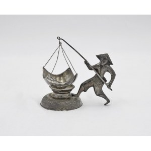 Tea strainer with fisherman figure