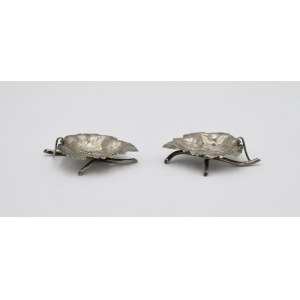 A pair of salt shakers in the form of leaves