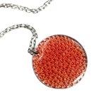 Enameled pendant along with a silver-colored chain