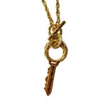 Gold-plated vintage pendant in the form of a key