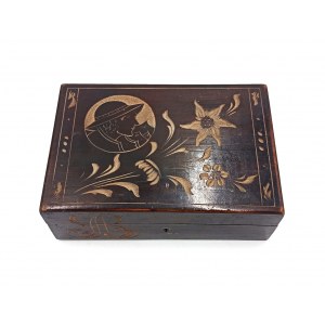 A cassette with a highlander and edelweiss motif,