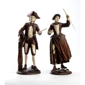 A pair of wood and bone carvings