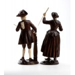 A pair of wood and bone carvings