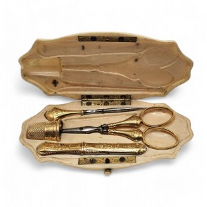 A French gold manicure with ivory case