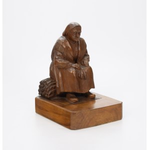 Elderly woman on a bundle of brushwood