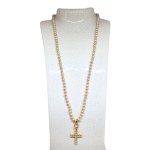 A pearl necklace with a cross encrusted with Swarovski crystals