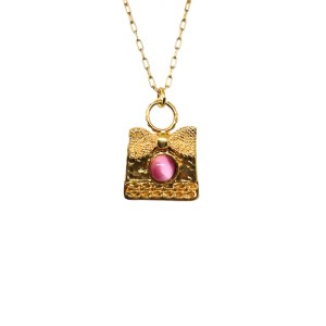 An elegant necklace with a pink stone