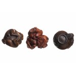 Three wooden netsuke figurines depicting monkeys