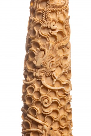 Ivory okimono in the form of a tusk covered with an ornament with a dragon motif