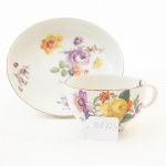 White porcelain cup with saucer with floral decoration,