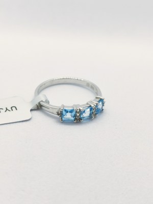 Silver ring with topazes
