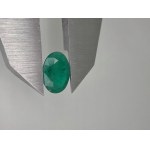 Natural emerald with a valuation of 1046 US dollars.