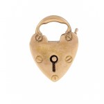Pendant in the form of a padlock with a four-leaf clover, early 20th century.