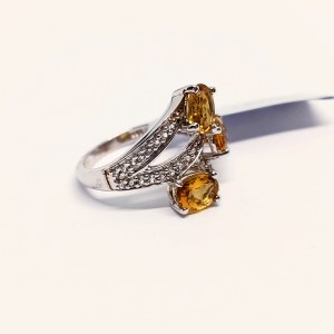 Silver ring with natural scapolites and topazes
