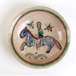 GUNTHER STUDEMANN (Berlino 1890 - 1981), Round plate with relief decoration of a horseman
