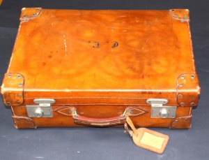 Leather suitcase with a set of underwear and travel toiletries, early 20th century (342)