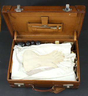 Leather suitcase with a set of underwear and travel toiletries, early 20th century (342)