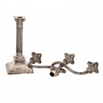 Three-armed silver candlestick with ionic capitals