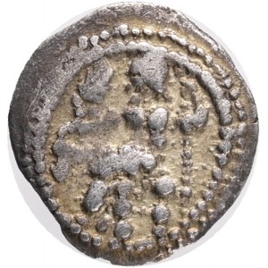 LYCAONIA.Laranda.(Circa 324-323 BC).Obol.Obv : Baaltars seated left, holding grain ear, bunch of grapes, and scepter.Rev : Forepart of wolf right; inverted crescent above; all within circle of pellets.Ref.:Göktürk 82-85. AR. 0,6g.